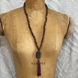 Handcrafted Wooden Bead Necklace with Purple Tassel
